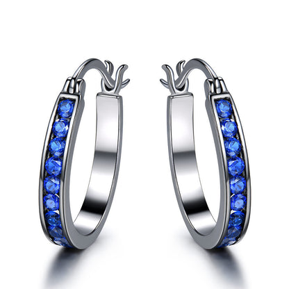 Brilliant silver hoop earrings with zirconium crystals