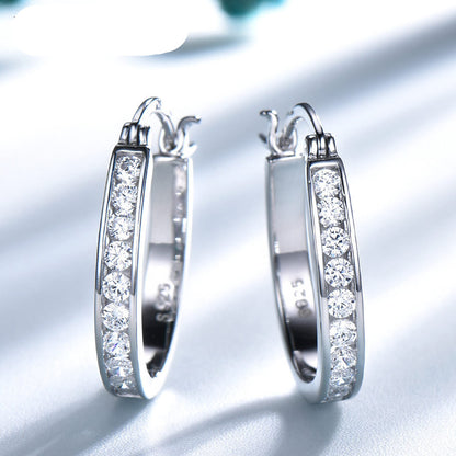 Brilliant silver hoop earrings with zirconium crystals